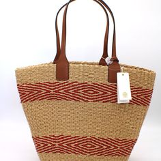 15"W X 12"H X 6"D. (Interior Capacity: Large.) Open Top Top Handles - 8 ½" Strap Drop. Flat Base Raffia With Leather Trim Style Tory Burch 74260 - Miller Straw Stripe Tote In Natural Brilliant Red Chic Red Woven Straw Bag, Chic Red Straw Bag With Braided Handles, Elegant Red Bags For Vacation, Elegant Red Bag For Vacation, Designer Red Bag With Braided Handles, Red Bucket Straw Bag For Travel, Red Woven Straw Bag For Shopping, Red Straw Bag With Leather Handles For Daily Use, Elegant Red Woven Bag