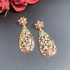 Featuring a pair of attractive multicoloured earrings in 22ct gold. Design inspired from the filigree art, these earrings weigh 14.11 GMs. Pefect earrings choice under 1 lakh or 1 lac. Ornate Yellow Gold Meenakari Earrings, Ornate Yellow Gold Earrings With Meenakari, Gold Kundan Filigree Earrings, Yellow Gold Kundan Earrings With Intricate Design, Traditional Kundan Filigree Earrings, Multicolor Kundan Danglers With Intricate Design, Gold Plated Filigree Earrings For Diwali, Multicolor Gold Plated Earrings For Wedding, Multicolor Gold-plated Earrings For Wedding