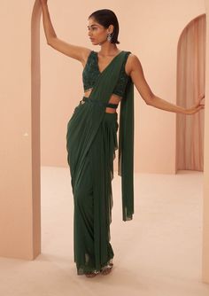 Parul Gandhi-Indian Green Draped Sari Set-INDIASPOPUP.COM Formal Pre-draped Saree With Zari Work, Elegant Draped Green Lehenga, Elegant Green Draped Blouse Piece, Formal Saree With Draped Sleeves And Traditional Drape, Elegant Draped Lehenga With Draped Sleeves, Designer Saree With Draped Sleeves, Festive Pre-draped Saree With Side Open And Draped Sleeves, Green Cutdana Pre-draped Saree For Evening, Formal Pre-draped Saree With Sheer Dupatta