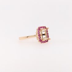 Discover a timeless classic with our Pink Sapphire Ring Semi Mount in Solid 14k Gold! This elegant emerald cut gemstone will make a stunning statement piece that will last for generations. With meticulous milgrain detail, this exquisite ring is the perfect way to show your love forever. Sapphire Halo Ring, Designer Silver Jewellery, Pink Sapphire Ring, Jewelry Showcases, Rose Gold Pink, Love Forever, Ruby Sapphire, Halo Ring, Earring Findings