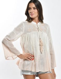 White bohemian embroidered top with lurex woven in for extra dreamy styling. Paired here with our Feeling Peachy ultra wide leg high waist pants. Bohemian Long Sleeve Embroidered Top For Vacation, Chic Flowy Peasant Top For Summer, Spring Bohemian Top With Embroidered Hem, Spring Bohemian Blouse With Embroidered Hem, Bohemian Long Sleeve Embroidered Top For Beach, Bohemian Tops With Embroidered Hem In Relaxed Fit, Bohemian Tops With Embroidered Hem And Relaxed Fit, Casual Embroidered Top With Boho Collar For Spring, Bohemian Embroidered Peasant Top For Spring