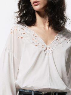 MO&Co. Women's Volume Sleeves Cotton Blouse Made from 100% cotton, this blouse is soft, breathable, and comfortable to wear. Designed with a charming Broderie Anglaise design, the V-neckline adds a touch of elegance, while the volume sleeves add a playful, modern twist. Pair it with your favorite jeans or a skirt for a chic look. Features : - Regular fit- V-neckline and volume sleeves- Delicate broderie anglaise design Code: MBD2TOPT52The back length of size S is 50.3cmMATERIALS & CARE Material: Volume Sleeves, A Skirt, Cotton Blouse, Cotton Blouses, Favorite Jeans, Sleeve Cotton, Twist, Skirt, How To Wear