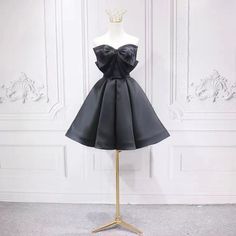 Black fashion homecoming dress, bow tie birthday party dressMaterial:satinColor:as picture or custom colorNeckline:straplessBack details:bandageStyle:fashionDress type: A-line&ltp&gtFeatures: bowknot</p>&ltbr/>&ltp&gtCustomized service and Rush order are available.</p>&ltbr/>&ltp&gtThis dress could be custom made, there are no extra cost to do custom size and color.</p>&ltbr/>&ltp&gtPlease leave your phone number for shipping