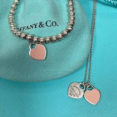 Tiffany & Co Pink Enamel Return To Tiffany Heart Necklace And Bracelet In 925 The Set Is In Preowned Condition And It Will Be Professionally Polished And Clean Prior To Shipment. Your Purchase Includes One Tiffany Pouch And A Box. The Bracelet Measures 7” Long With An Approx 0.39”X0.46” Heart The Necklace Measures 17” Long With An Approx 0.39”X0.46” Heart. Igm L3 Tiffany Heart Necklace, Heart Necklace Tiffany, Jewelry Tiffany, Return To Tiffany, Tiffany Co Jewelry, Necklace And Bracelet, Pink Enamel, Tiffany Heart, Tiffany & Co.