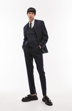 A lightly textured weave distinguishes neatly pressed trousers tailored in a skinny fit that looks smart whether worn with casual or formal styles. 31" inseam; 14" leg opening; 10 1/2" front rise; 14" back rise (size 32) Zip fly with hook-and-bar closure Front slant pockets; back welt pockets 64% polyester, 34% viscose, 2% elastane Dry clean Imported Slim Fit Suits With Straight Pants For Semi-formal Occasions, Semi-formal Slim Fit Suits With Straight Pants, Elegant Dress Pants In Suiting Fabric For Office, Tailored Business Casual Pantsuit With Hidden Button Closure, Slim Fit Suits With Straight Pants For Formal Occasions, Slim Fit Formal Suits With Straight Pants, Tailored Tapered Leg Suits For Formal Occasions, Formal Slim Fit Suits With Straight Pants, Tailored Tapered Leg Suits For Formal Events