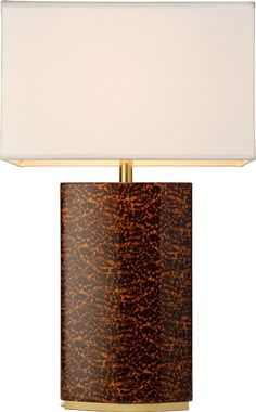 a table lamp with a white shade on it's base and a gold metal frame