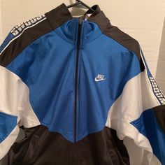 Nike Vintage Jacket ! Size Small! Blue Navy Track Jacket For Spring Streetwear, Blue Sportswear Outerwear For Spring, Blue Sport Coat With Pockets For Streetwear, Blue Spring Sportswear Outerwear, Casual Blue Hooded Sport Coat, Blue Sporty Winter Outerwear, Sporty Blue Winter Outerwear, Blue Sportswear Windbreaker With Pockets, Blue Sportswear Windbreaker For Spring