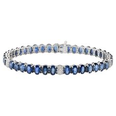 Experience incredible sparkle and elegance with this exquisite 18KT white gold bracelet featuring 24.29CT-tw of oval genuine blue sapphires. The vivid blue hues are complemented by 0.24CT-TW of round brilliant-cut diamonds, exhibiting a stunning G color and VS clarity. This bracelet is a true showcase of luxury, combining the captivating brilliance of diamonds with the timeless beauty of blue sapphires, making it a statement piece for any sophisticated occasion. Diamond Drop Pendant, White Gold Pendant Necklace, Bracelet Tennis, Modern Bracelets, Drop Pendant Necklace, White Gold Bracelet, Stylish Bracelet, Vs Diamond, Tennis Bracelet Diamond