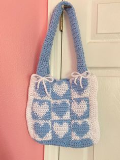 A cute tote bag to hold your things. White Crochet Tote Bag For Shopping, Cute Rectangular Crochet Bag For Everyday Use, White Square Crochet Bag For Shopping, Cute Everyday Crochet Rectangular Bag, Cute Handmade Square Crochet Bag, Trendy Blue Crochet Tote Bag, Vacation Blue Crochet Bag, White Crochet Bag With Double Handle For Everyday Use, Cute Crochet Rectangular Shoulder Bag