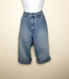 This is a pair of capri/cropped Lee Riveted jeans. They are high rise with all the fun details of carpenter jeans. Loops and pockets and wide belt loops add interest. Faded medium blue wash. Size 10 M. Check measurements carefully. Measurements taken with jeans laying flat and doubled where appropriate. In order to determine fit we recommend comparing measurements with an item that fits you well. Length 29 inches Waist 32 inches Hips 40 inches Inseam 19 inches Rise 10 inches Always happy to answ Vintage High Rise Cargo Jeans For Spring, Vintage Medium Wash Cargo Jeans For Spring, Vintage Denim Cropped Jeans For Spring, Medium Wash Wide Leg Cropped Jeans With Belt Loops, Spring Retro Cropped Denim Jeans, Retro Denim Cropped Jeans For Spring, Retro Spring Cropped Denim Jeans, Vintage Wide Leg Cropped Jeans For Spring, Blue Cropped Jeans With Belt Loops For Spring