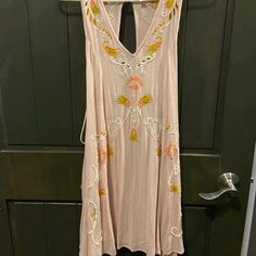 Blush Pink Dress From Free People Intimately. Tank Top Design. V-Neckline. Embroidered Eyelet Detailing. Lace Up Sides On The Back With Tasseled Ends. Button Loop Back Closure With Keyhole. Shift Dress. Mini Style/Above The Knee Length. Boho Style. Relaxed, Flowy, Comfortable Fit. Made Of 100% Rayon. New With Tags Size Xsmall Length- 34in Pit To Pit- 16.5in Boho, Bohemian, Summer, Floral, Design, Resort, Beach, Summer, Spring, Vacation, Cruise, Trip, Tropical, Bohemian Peach V-neck Mini Dress For Beach, Pink Sleeveless Floral Embroidered Mini Dress, Pink Sleeveless Mini Dress With Floral Embroidery, Pink Floral Embroidered Sleeveless Mini Dress, Pink Floral Embroidery Sleeveless Mini Dress, Pink V-neck Mini Dress With Floral Embroidery, Pink Bohemian V-neck Mini Dress, Pink Embroidered V-neck Dress, Pink Embroidered Summer Dress