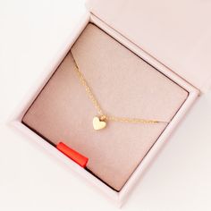 Dress up daily with our Gold Pendant Necklace with Heart Charm. This cute delicate necklace features a dainty gold pendant adorned with a Heart, designed to add a classic touch to an every day. This necklace is a timeless keepsake, we guarantee she will love. Each necklace comes in a gift box. You may also like our Heart Earring.