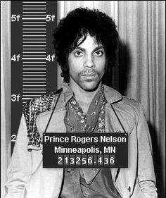 prince rogers nelson mug shot in front of a measuring tape with the name princess roger's nelson minneapolis, mn