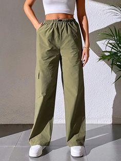 Stay effortlessly stylish with our Casual Plain Cargo Cropped Pant. These pants feature a cropped length and a clean, plain design, offering a versatile and contemporary style. With a relaxed fit and comfortable fabric, they are perfect for casual and everyday wear. These cargo cropped pants are a must-have addition to your wardrobe for a trendy and laid-back look.Specification: Style: Casual Pattern Type: Plain Type: Cargo Pants Closure Type: Elastic Waist Details: Pocket Waist Line: Natural Le Casual Plain Workwear Pants, Casual Plain Pants For Work, Solid Color Relaxed Fit Cargo Pants, Relaxed Fit Solid Cargo Pants, Sporty Everyday Cargo Style Bottoms, Sporty Everyday Cargo Bottoms, Everyday Sporty Cargo Bottoms, Relaxed Fit Cargo Wide Leg Pants, Spring Outdoor Solid Color Parachute Pants