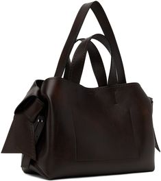 Buffed calfskin shoulder bag in brown. · Fading throughout · Carry handle · Adjustable shoulder strap · Knotted accent at sides · Logo stamp at face · Press-stud closure · Zip pocket at interior · Buffed lambskin lining · H8.5 x W9.5 x D6 Supplier color: Dark brown Brown Calf Leather Satchel With Top Carry Handle, Brown Calf Leather Satchel With Adjustable Strap, Brown Calf Leather Bag With Adjustable Strap, Brown Calf Leather Shoulder Bag With Double Handle, Acne Shop, Logo Stamp, Press Studs, Pink Bag, Mini Bag