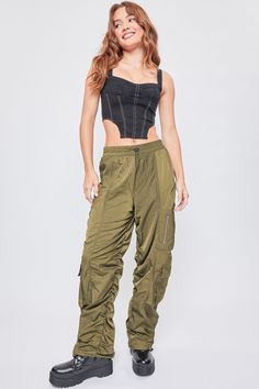 Green Nylon Parachute Pants With Cargo Pockets, Green Nylon Parachute Pants For Streetwear, Green Wide Leg Nylon Bottoms, Green Utility Parachute Pants In Nylon, Green Utility Nylon Parachute Pants, Green Nylon Utility Parachute Pants, Green Wide-leg Nylon Bottoms, Green Nylon Cargo Pants, Green Nylon Cargo Bottoms