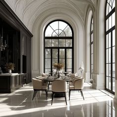 an elegant dining room with high ceilings and large windows