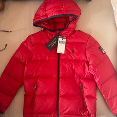 100% Real/Authentic Polo Ralph Lauren Puffer Jacket Brand New Never Won In Plastic Original Price $125 Size Is In Boys Not Girls Red Outerwear With Adjustable Hood For Cold Weather, Red Hooded Puffer Jacket With Detachable Hood, Red Hooded Puffer Jacket For Outdoor, Red Puffer Jacket With Detachable Hood, Red Hooded Puffer Jacket With Pockets, Hooded Red Puffer Jacket For Outdoors, Ralph Lauren Winter Hoodie, Red Hooded Jacket With Double-lined Hood For Cold Weather, Luxury Red Puffer Jacket For Outdoor