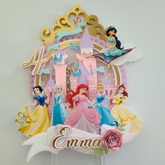 there is a cake topper with princesses on it