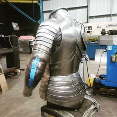 a large metal armor sitting on top of a table