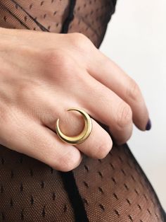 This ring is a piece from Keras collection.Sculptured and casted in solid sterling silver 925 and then double gold plated with 22k gold.Very nice and important weight. The crescent is 20mm (0.787 inch) All of my jewelry is handmade please allow for small variances from piece to piece ,as this is a feature of owning one of a kind original handmade jewelry. Feel free to ask me for personal orders . -22k gold platted Sterling silver 925 You may also like on bright silver https://www.etsy.com/listin Celestial Gold Crescent Rings, Mystical Crescent Rings With Moon Charm, Celestial Crescent Gold Rings, Mystical Crescent Moon Charm Rings, Gold Celestial Moon Ring, Elegant Crescent Moon Charm Rings, Minimalist Crescent Moon Charm Ring, Gold Sterling Silver Ring With Moon Charm, Gold Moon Charm Promise Ring