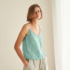 "You can never have too many all-season friendly tops. FEATURES: * relaxed fit * spaghetti straps * wrinkly fabric * top length is 50 cm / ~20\" (size S) * 100 % natural, certified linen fabric * dyed and washed in small batches * natural cotton yarns * handmade at a small studio in Europe COLORS: Dyed and washed in small batches, so the color will be unique and superb quality to each piece. Please check the color options on the side menu. SIZE GUIDE / BODY MEASUREMENTS: XS Bust 28- 31\" (72- 80 Summer V-neck Camisole For Vacation, Relaxed Fit V-neck Tank Top For Spring, Spring V-neck Camisole With Adjustable Straps, Cotton V-neck Camisole With Adjustable Straps, Summer Cotton V-neck Camisole, Chic Relaxed Fit V-neck Top For Summer, Green V-neck Summer Camisole, Casual Summer Tank Top With Delicate Straps, Casual Spring Tank Top With Delicate Straps