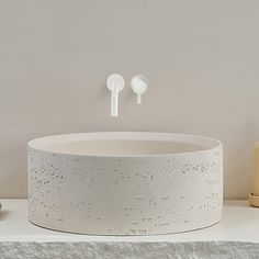 a white sink sitting on top of a counter