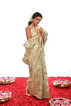 Designed to stand out from the crowd, this one-of-a-kind creation in Sage Green is a luxurious choice crafted with fine Gota Patti hand work on exquisite Organza silk. An exclusive piece, it radiates timeless elegance and looks stunning in any setting. Elegant Pista Green Sets With Gota Work, Tussar Silk Blouse Piece For Party, Formal Festive Pre-draped Saree With Intricate Embroidery, Elegant Silk Pre-draped Saree For Festive Occasions, Elegant Green Pre-draped Saree For Transitional Season, Elegant Silk Pre-draped Saree For Diwali, Formal Organza Pre-draped Saree For Diwali, Elegant Art Silk Pre-draped Saree With Cutdana, Silk Pre-draped Saree With Zari Work For Formal Occasions