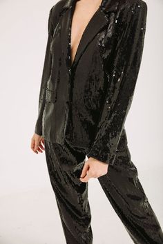 Stand out in this classic sequin blazer at all events!!!Fabric used is sequin and it is lined with a soft lining so it's very comfortable to the skinJacket length is 27cm and trouser length is 45cm Model is 5'9 and is wearing a US Size 4Care instruction - Dryclean or handwash. No need to iron Color - Black The blazer is a boyfriend jacket with shoulder pads and is loosely fitted and the trouser is a high waist pant fitted at the waist and loose from the thighs down Black Sequin Blazer, Blazer With Shoulder Pads, Boyfriend Jacket, Trouser Suit, Womens Suits, Silk Jumpsuit, Sequin Blazer, Boyfriend Blazer, A Boyfriend