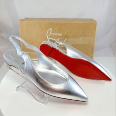 Nwt$795 Louboutin Hot Chickita Silver Leather Slingback Flats Sz 38 (Left Shoe) And 38.5 (Right Shoe) **Half Size Difference Between The Pair- Hardly Noticeable Difference Since It's A Slingback** Christian Louboutin's Hot Chickita Flats Are Crafted Of Metallic Leather With A Scalloped Slingback Strap. Leather Upper Point Toe Slips On Tpu Sole Made In Italy Brand New From Saks Fifth Avenue!! Strikeout To Prevent Returns Back To Saks. 100% Authentic With Original Box!! Tags: Fall, Autumn, Hallowe Silver High Heel Luxury Slingback Pumps, Luxury Silver High Heel Slingback Pumps, Modern Silver Leather Slingback Pumps, Luxury Silver Slingback Pumps With Heel Strap, Luxury Silver Slingback Heels, Silver Slingback Pumps With Branded Heel For Evening, Luxury Silver Slingback Pumps For Evening, Silver Leather Pointed Toe Slingback Pumps, Luxury Slingback Pumps With Flat Heel For Formal Occasions