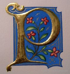 the letter q is decorated with flowers and leaves in gold on a blue tile background