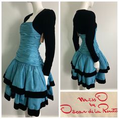 "Beautiful 1980s Miss O by Oscar de la Renta dress. Gorgeous blue taffeta with tule layered under each tier, black velvet sleeves and trim on skirt. This label is a step down from couture, and is constructed beautifully. Center back zipper closure, gathered bodice, this dress is quite heavy and full. There are a few faint small water marks on the skirt that are not very noticeable but mentionable. as this item has not yet been cleaned and  we have priced it accordingly. It's an absolutely stunning dress and really shows it quality and design Bust: 32\" Waist: 26\" Hip: 32-34\" Sleeve: 23.25\" Length: 39.25\" If you have any questions or would like more information about this listing, please don't hesitate to ask." 1980s Dresses Casual, Blue Dress Styling, 1980's Dresses, Dress Upcycling, 80s Formal Dress, 2000 Dresses, Dynamic Clothes, Blue Dress With Sleeves, 2000s Dresses