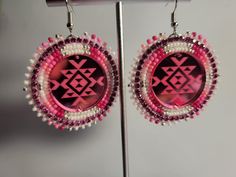 Native American beaded Pink Earrings Size 11/0 czech/seed beads with pink rhinestone banding. Round 25mm Mirror Acrylic Cab. Hypoallergenic Silver Earring Hooks with clear earring backs. white leather backing. Circle Beaded Earrings, Beaded Cab Earrings, Faceted Beaded Earrings For Gift, Round Faceted Beaded Earrings For Gifts, Traditional Pink Jewelry With Ear Wire, Gift Round Faceted Beaded Earrings, Pink Beads For Jewelry Making, Faceted Beads Round Beaded Earrings As Gift, Pink Beaded Earrings With Round Beads As Gift