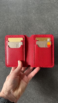 Discover the perfect combination of style, functionality and compactness with our leather bifold wallet. Our men's leather wallet is designed for those who value quality and convenience. It is ideal for everyday use. The small red women's wallet is suitable for women/girls who value elegance and practicality. The minimalist bifold wallet is small in size to easily fit into a pocket or bag without adding unnecessary bulk. The classic leather bifold wallet is a universal gift for her or for him fo Red Leather Everyday Card Holder, Red Bifold Wallet For Everyday Use, Everyday Red Card Holder With Card Slots, Everyday Red Card Holder With Slots, Red Bifold Card Holder, Red Bifold Card Holder With Interior Slots, Handmade Red Wallet For Everyday Use, Handmade Red Wallet, Red Bifold Wallet With Rfid Blocking