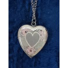 Vintage Sterling Silver 18" chain & about 1" heart locket. Front of heart has decorative etching with slight pink and yellow tones. Silver is tarnished on heart and chain. Comes in original box which shows some wear. Appears to not have been worn. Vintage Personalized Open Heart Jewelry, Vintage Personalized Open Heart Necklace, Personalized Vintage Open Heart Necklace, Personalized Vintage Heart Necklace, Vintage Open Heart Engraved Locket Necklace, Vintage Open Heart Locket Necklace For Valentine's Day, Vintage Engraved Open Heart Locket Necklace, Vintage Double Heart Engraved Necklace, Vintage Double Heart Personalized Jewelry