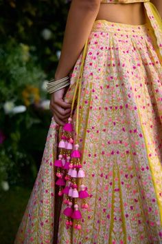 Raspberry purple raw silk lehenga with an attached cancan and multi-colored gota and thread embroidery. Comes with a padded blouse, a dupatta and a belt. - Aza Fashions Traditional Anarkali Set With Tassels, Festive Pink Sharara With Tassels, Festive Pink Tassel Sharara, Bohemian Anarkali Set With Tassels For Navratri, Bohemian Anarkali Set With Tassels For Festivals, Traditional Anarkali Set With Tassels For Navratri, Diwali Anarkali Set With Tassels And Traditional Drape, Bollywood Anarkali Set With Tassels For Festivals, Bollywood Style Festive Anarkali Set With Tassels