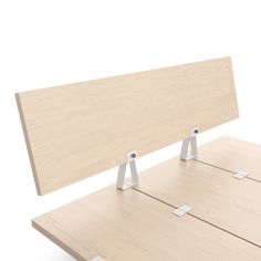 a wooden table with two metal brackets on it's back and one is empty