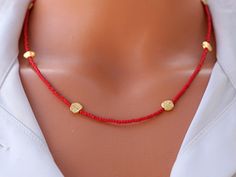 Elevate your style with our Red Afghan Stone Necklace, a dazzling piece of handcrafted bohemian jewelry! 🌹 Crafted with care, this 42 cm necklace comes with a 3 cm extender, featuring vibrant red Afghan stones paired with gold-plated disks for an extra touch of glamour. 💖 Let the rich red hues and the golden accents of this necklace be the statement piece that sets your style apart. Perfect for any occasion, this accessory adds a playful and unique touch to your look. Remember to handle it wit Bohemian Red Necklaces For The Beach, Red Bohemian Necklace For Beach, Bohemian Red Necklace For Beach, Red Bohemian Beaded Necklace For Gift, Bohemian Red Beaded Necklace For Gift, Bohemian Red Choker With Colorful Beads, Red Beaded Jewelry For Gifts, Red Bohemian Choker With Colorful Beads, Gold Beads Jewelry For The Beach