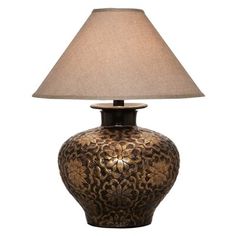 a table lamp with a brown base and a beige shade on the top of it