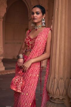 Maroon pre-draped gharara saree with thikri, grid and floral print and sequins embroidery. Comes with a padded blouse and a potli bag. - Aza Fashions Bandhani Print Dress For Reception, Reception Georgette Dupatta With Bandhani Print, Georgette Bandhani Print Dupatta For Reception, Reception Dupatta In Georgette With Bandhani Print, Navratri Bandhani Print Sharara For Reception, Traditional Bandhani Print Saree For Reception, Saree With Bandhani Print For Reception, Navratri Wedding Palazzo Set With Bandhani Print, Wedding Palazzo Set With Bandhani Print For Navratri