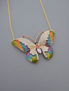 "Vintage Jewelry - Statement Necklace - Vintage Inspired Necklace - Butterfly Necklace - Gold Necklace - Colorful Necklace Crystal Necklace This is a gorgeous vintage inspired butterfly necklace! Encrusted with sparkling crystals in pink, and purple with the wings painted with a myriad of colors with enamel. The pendant hangs from a gold plated chain. A stunning statement piece. Chloe says, \"Wear it and feel fabulous!\" You can choose the chain length you would like at checkout.. The pendant is Colorful Pendant Jewelry As A Gift, Multicolor Pendant Necklace For Party, Multicolor Pendant Necklace In Costume Jewelry Style, Multicolor Pendant Necklace For Costume Jewelry, Colorful Costume Jewelry Gift, Colorful Costume Jewelry For Gifts, Pink Colorful Jewelry As A Gift, Handmade Multicolor Butterfly Necklace For Gift, Pink Jewelry For Gift