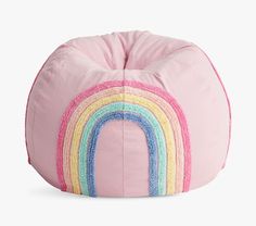 a pink bean bag with a rainbow design on it