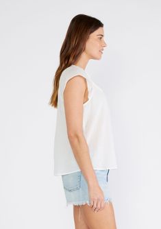 A warm-weather cap sleeve top crafted from lightweight cotton gauze. Cotton Relaxed fit Short cap sleeve Split v-neckline with raw edge hem Shirred yoke Sheer Bohemian spring top A simple throw-on-and-go style that adds instant bohemian charm to any outfit. Our essential cotton top features short cap sleeves, a shirred yoke, and a split v-neckline with a raw edge hem for an effortless, undone feel. Model is 5'9, wearing a size S.Style: I-15323W-SQV Breezy Cotton Short Sleeve Blouse, Breezy Short Sleeve Cotton Blouse, Spring Short Sleeve Cotton Gauze Tops, Spring Cotton Gauze Short Sleeve Tops, Summer Cap Sleeve Tops, Casual Cotton Gauze Short Sleeve Tops, Casual Short Sleeve Cotton Gauze Tops, Spring Relaxed Fit Cotton Gauze Tops, Spring Cotton Gauze Tops With Relaxed Fit