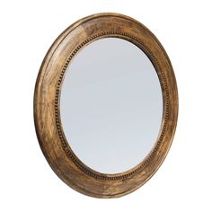 a round mirror with beaded trim around the edges and an oval wooden frame, on a white background