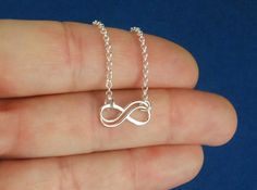 Sterling silver double infinity necklace, infinity knot, infinity symbol, bridal jewelry, sterling silver necklace, eternity necklace A double wire infinity link is attached to a sterling silver chain that can be any length up to 22 inches in length and is secured with a sterling silver lobster claw clasp. You can choose between the small, medium, and large infinity links. The small infinity measures 0.55 x 0.26 inches (14 x 6.5mm). The medium infinity measures 0.79 x 0.37 inches (20 x 9.5mm). T Double Infinity, Infinity Knot, Infinity Symbol, Infinity Necklace, Lovely Jewellery, Infinity Bracelet, Chain Styles, Sterling Silver Necklaces, Sterling Silver Chains