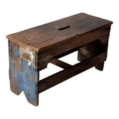 an old wooden bench with blue paint on the top and bottom, sitting against a white background