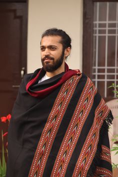 "These meditation hand-loomed shawls are made locally in a small village located in Himachal Pradesh, India. Each shawl has a layered border with intricately spooled geometric patterns done in different color as; browns, blacks, greys and reds. These shawls are great for meditation and to have after asana practice. When you learn and get to experience the sheer degree of detail and skill that is poured into every handwoven shawl, you begin to appreciate the beauty of the workmanship. It is no wo Traditional Multicolor Handwoven Shawl, Traditional Handwoven Shawl For Festival, Traditional Brown Handloom Shawl, Traditional Handwoven Black Shawl, Traditional Winter Shawl With Traditional Patterns, Traditional Winter Shawl With Patterns, Traditional Handwoven Shawl Scarf, Traditional Handmade Pashmina Shawl, Traditional Shawl With Woven Motifs For Festivals