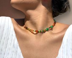 Mixed Glass Beads that gives a boho vibe.   ✦ Mixed Glass Beads  ✦ Green, Brown and Orange Beads ✦ Length: 16 inches ✦ Boho Style ✦ Gold Filled Spring Clasp FOLLOW US ˚. ✦. ⋆.✧̣̇˚. Instagram: @SinTiJewelry Facebook: https://www.facebook.com/people/Sin-Ti/100069170148290/?mibextid=LQQJ4d Hippie Style Beaded Necklaces With Gemstone Beads, Bohemian Beaded Necklace With Faceted Oval Beads, Earthy Beaded Necklaces With Colorful Beads As Gift, Earthy Beaded Necklaces As Gifts, Bohemian Necklace With Oval Faceted Beads, Bohemian Style Crystal Necklaces With Faceted Beads, Bohemian Crystal Necklaces With Faceted Oval Beads, Handmade Hippie Green Beaded Necklaces, Bohemian Necklace With Oval Beads