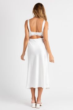 Giving us angel energy with a bit of spice. The Ethereal Slip Dress is the dress of the season! Made from satin with lace trim, open back detail and a midi length. Color: White Satin Midi Length Lace Trim Open Back With Button Closure Polyester Lined Model Is 5'5", 24/25 Waist, 32A Bust & Wearing Size Small Sleeveless Lace Dress With Satin Trim, Satin Dress With Lace Trim For Date Night, Evening Satin Midi Dress With Lace Trim, Satin Midi Dress With Lace Trim For Evening, Satin Lace Back Dress For Night Out, Satin Midi Length Dresses With Lace Trim, Satin Midi Dress With Lace Trim For Party, Party Satin Midi Dress With Lace Trim, White Midi Length Slip Dress With Lace Trim