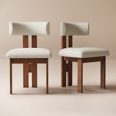 two wooden chairs with white upholstered fabric on them, one in the shape of a rectangle